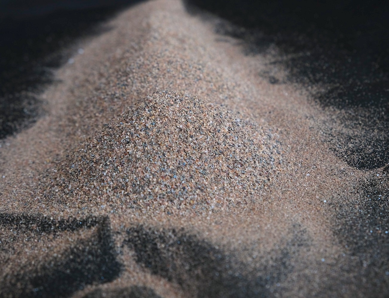 High-purity silica sand close-up, representing the precision and quality control behind Lumara's industrial product supply